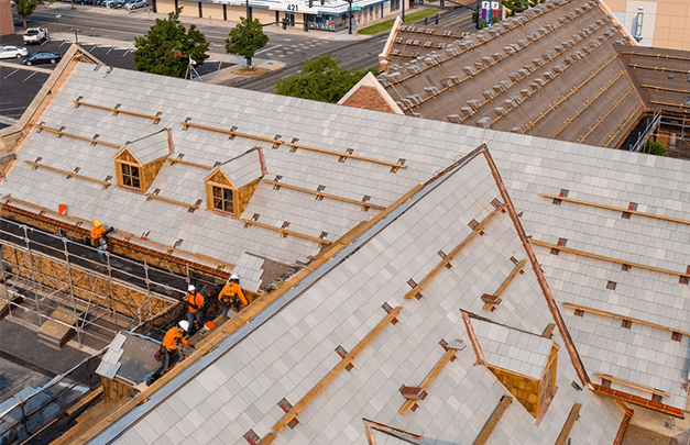 construction workers working on roof