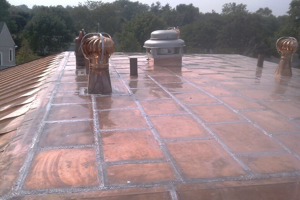 CUSTOM COPPER ROOF WITH COPPER PANELS AND TURBINE VENTS