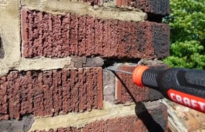 Restorative work being done on brick siding