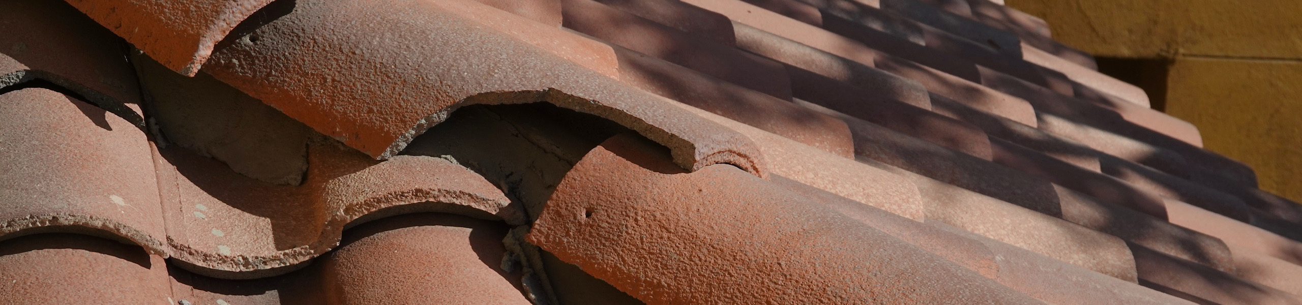 damaged clay tile roof